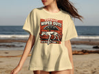 Cream t-shirt with "Totally Wiped Out! Bone Tired Tour '74" text and a reclining dog on a couch.