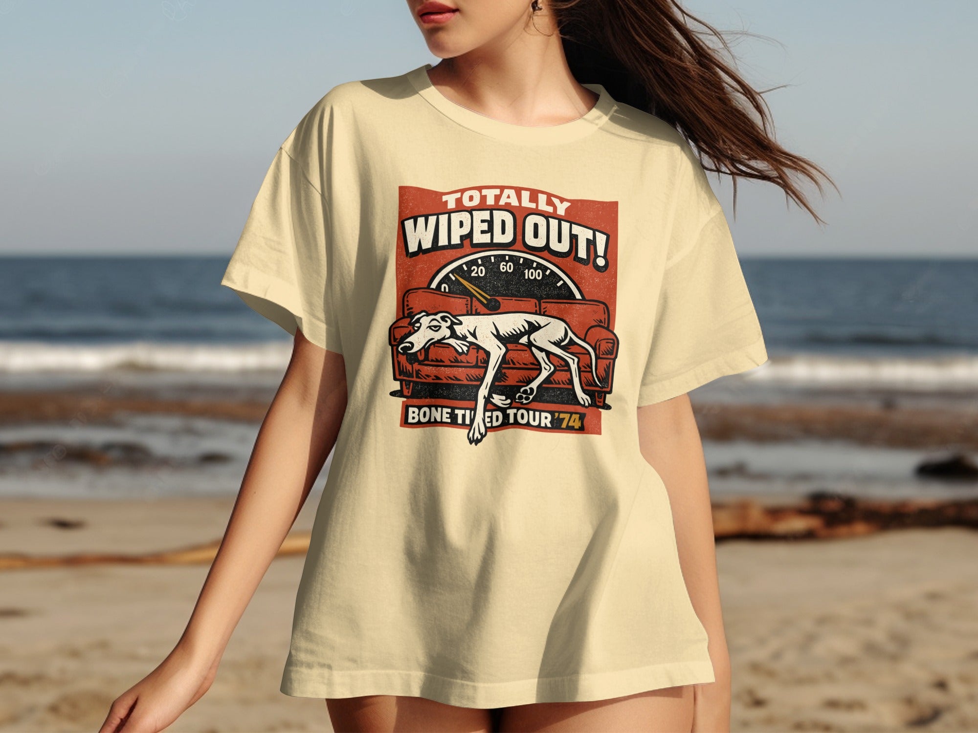 Cream t-shirt with "Totally Wiped Out! Bone Tired Tour '74" text and a reclining dog on a couch.