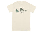 Cream t-shirt with black text: "Eat. Sleep. Steal Socks. Repeat." and a small dog silhouette.
