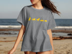 Gray t-shirt with yellow dog graphics depicting a sequence of actions.