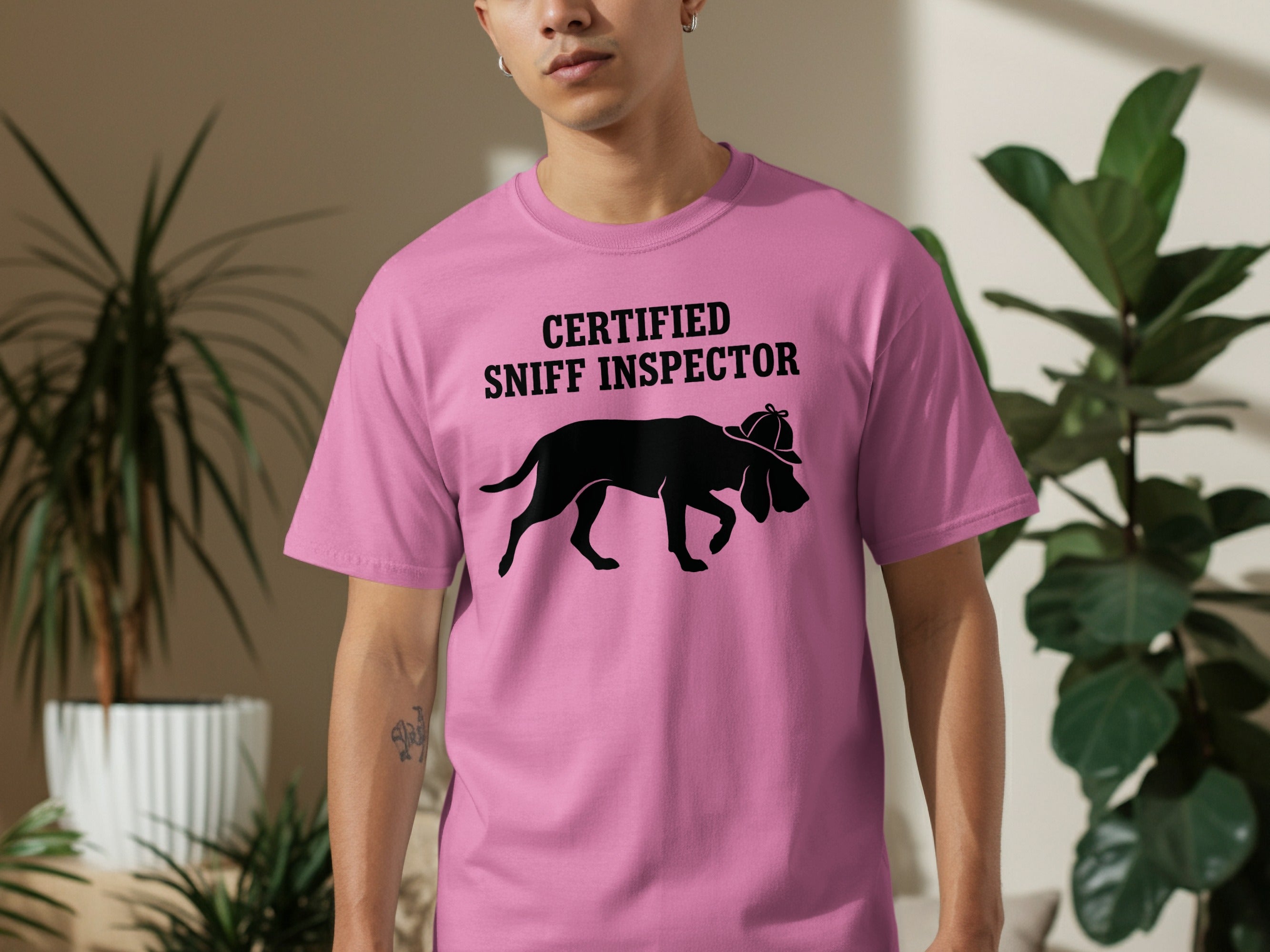 Pink t-shirt with dog silhouette labeled "CERTIFIED SNIFF INSPECTOR".