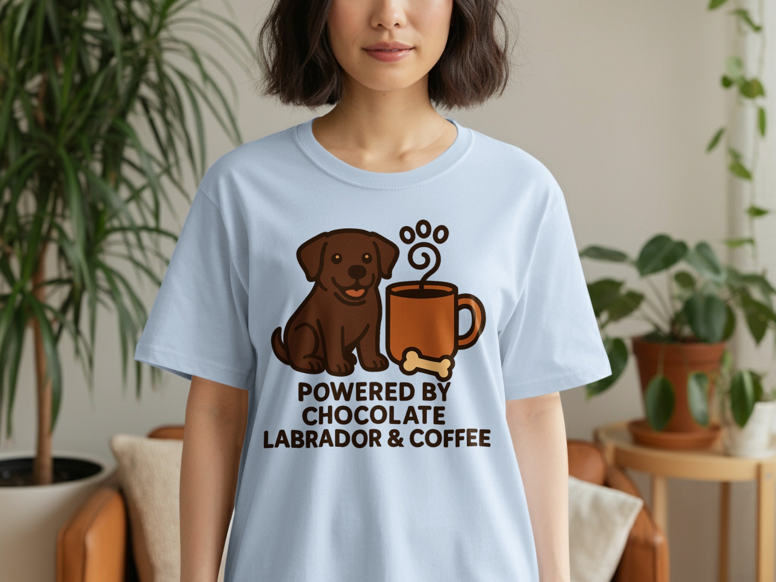 Light blue t-shirt with chocolate Labrador, coffee cup, bone, and "Powered by Chocolate Labrador & Coffee" text.