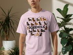 Pink t-shirt with heart-shaped dachshund pattern and "DOXIEHOLIC" text.