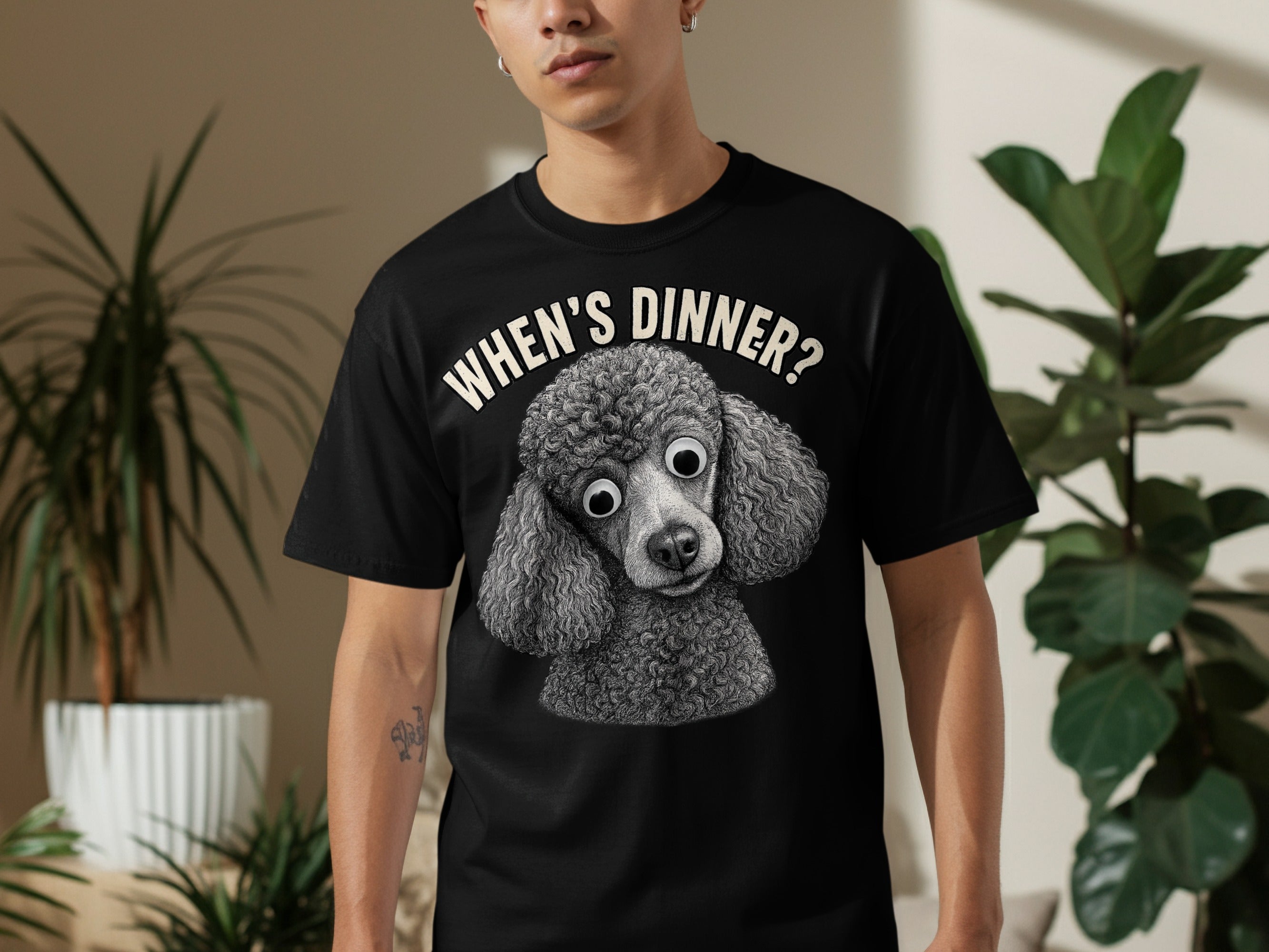 Black t-shirt with a close-up poodle graphic and "WHEN'S DINNER?" text.