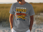 Man wearing grey t-shirt with text "UNKNOWN FORCES HAVE TAKEN CONTROL THE ZOOMIES" and a running dog.