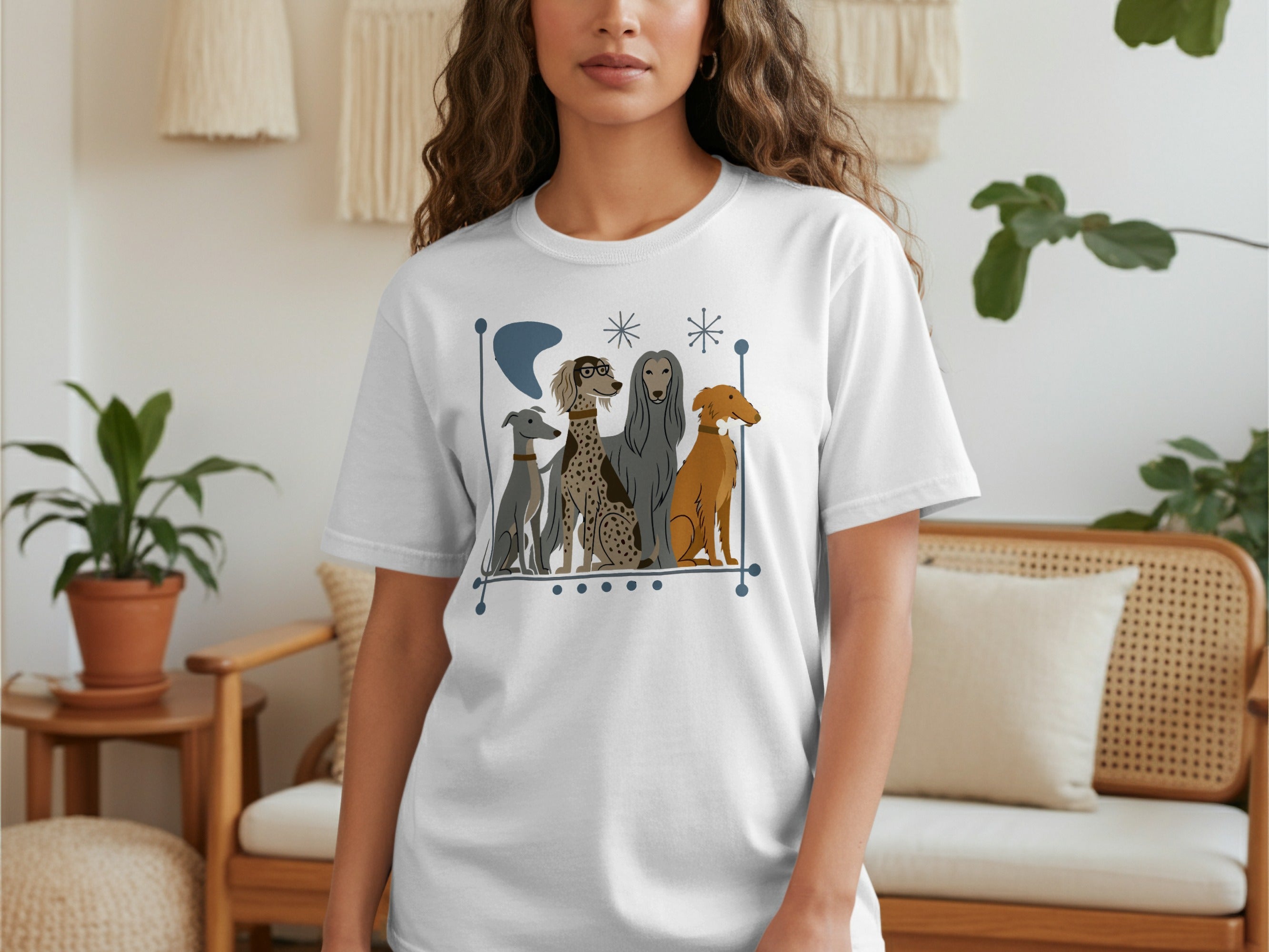 White t-shirt featuring a graphic of four stylized dogs in muted colors.
