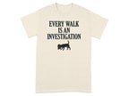 T-shirt with "Every Walk is an Investigation" text and a dog silhouette.