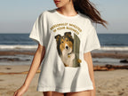 Shetland sheepdog peeking through an open door on a white t-shirt.