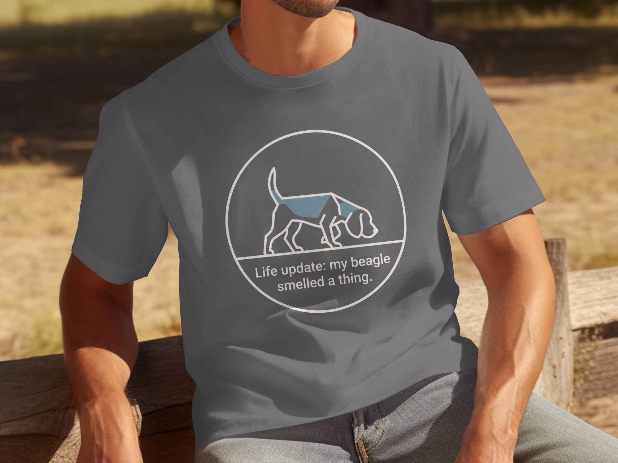 Dark grey t-shirt with white circular graphic of a beagle and text.