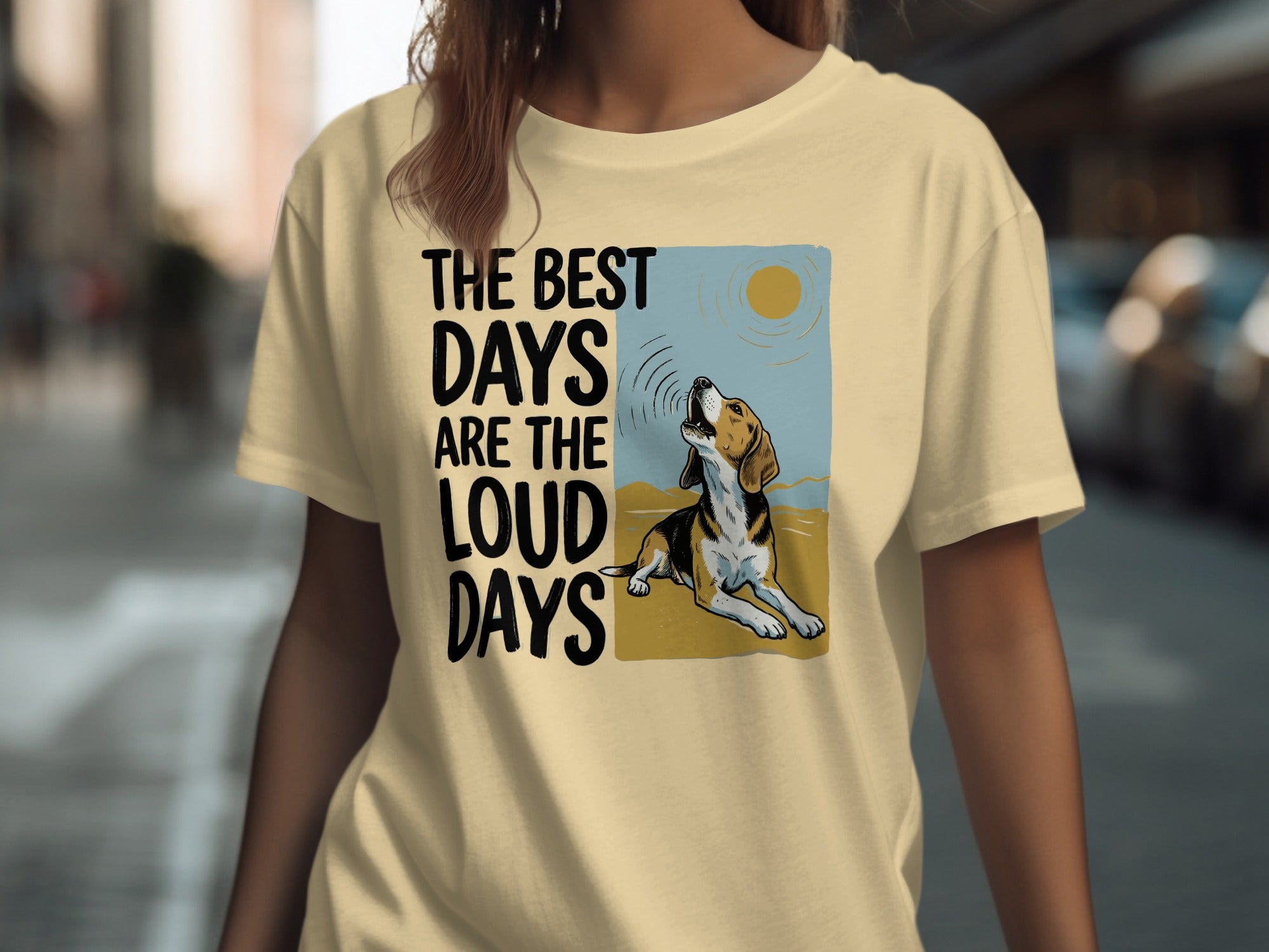 T-shirt with dog howling at sun graphic and text "The best days are the loud days."