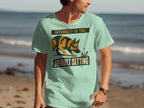 Man wearing a mint green t-shirt with a German Shepherd and text.