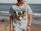 T-shirt with a Belgian Malinois dog running with a ball, "Always Operating At Full Capacity" text.