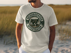 T-shirt with a circular graphic of a dog wearing a hat, labeled "Neighborhood Investigator".