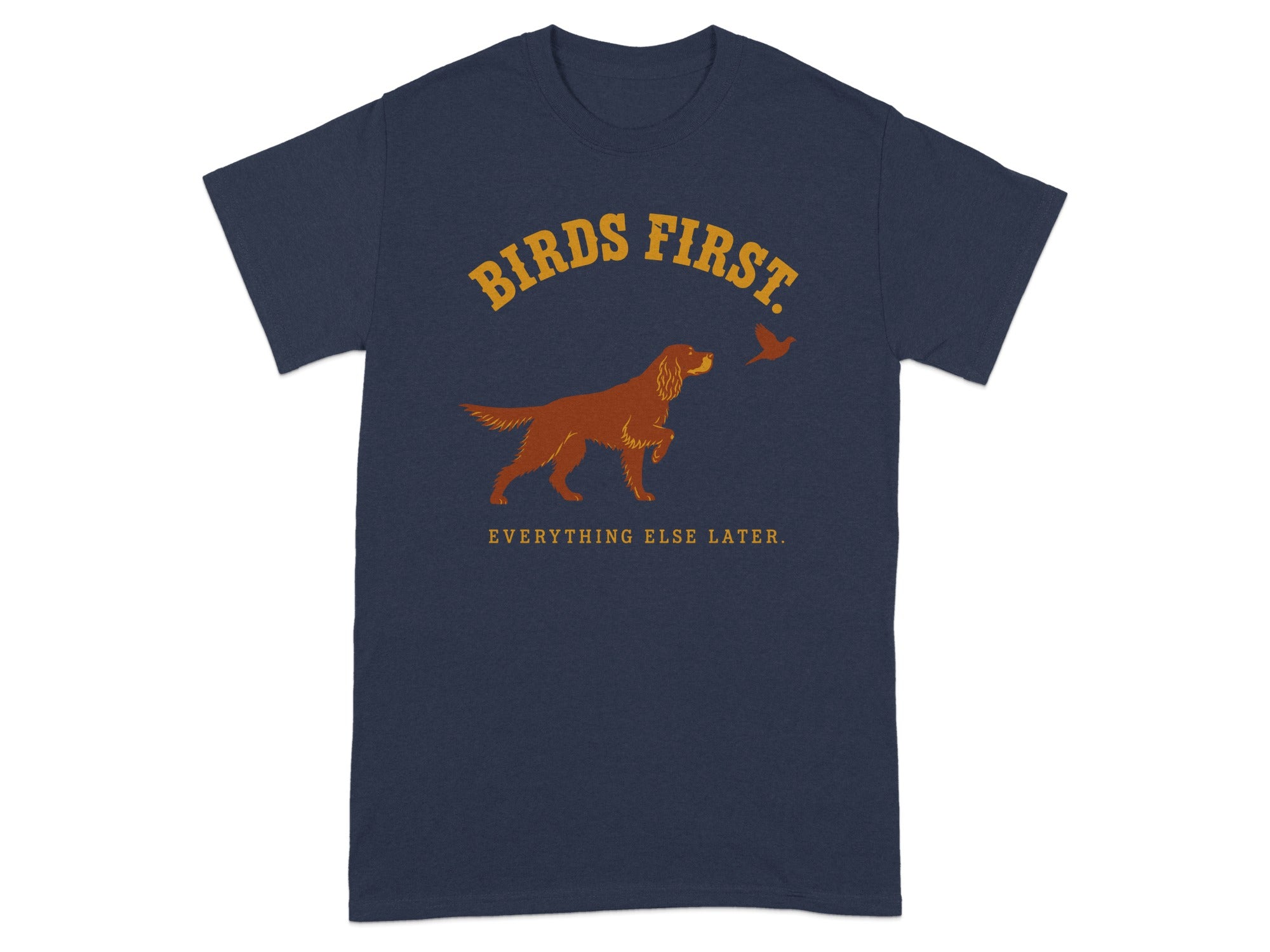 Navy t-shirt with dog and bird graphic and "BIRDS FIRST. EVERYTHING ELSE LATER." text.