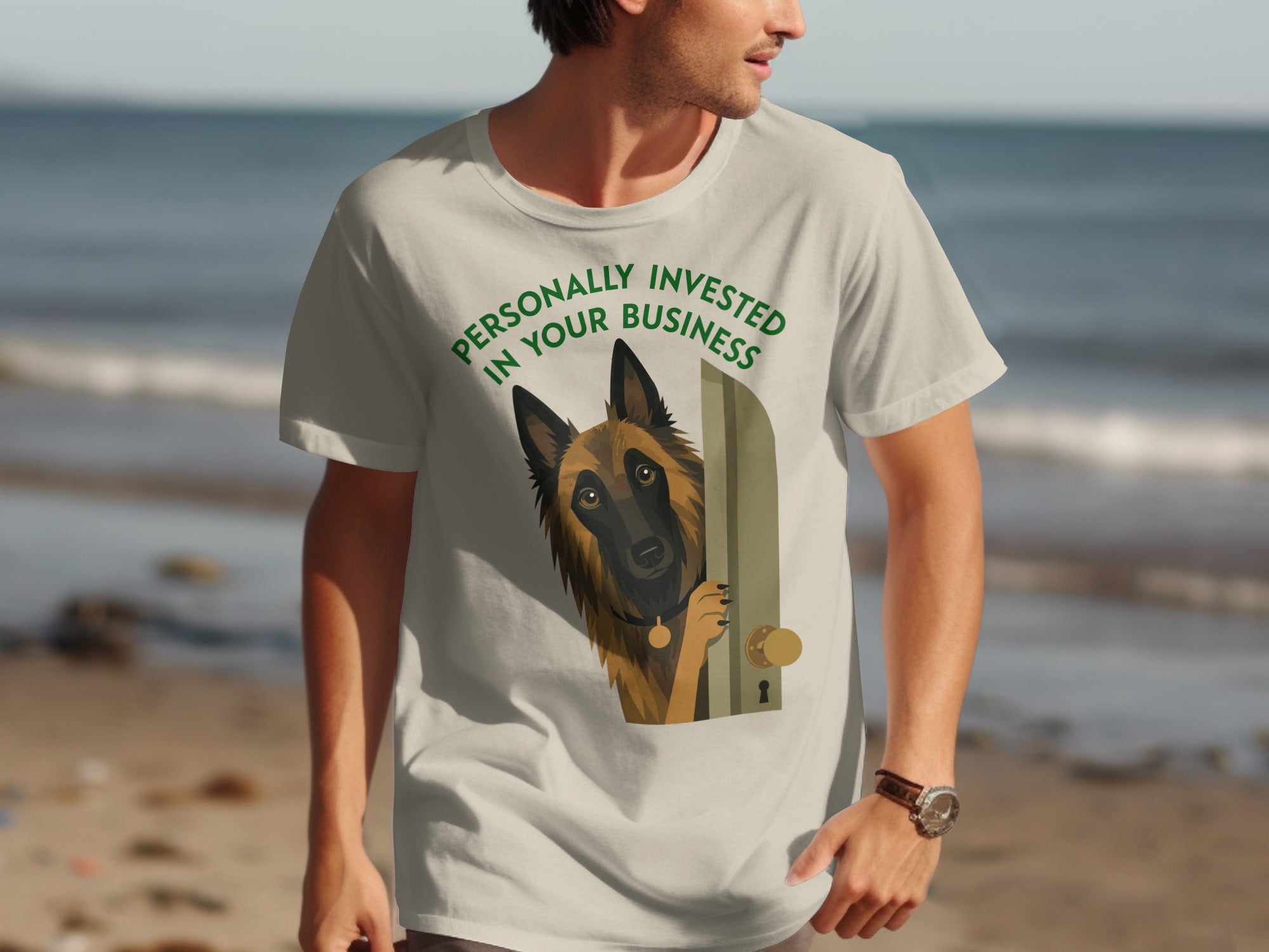 Light tan t-shirt with a dog peeking through a doorway, text reads "Personally Invested In Your Business".