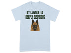 Light blue t-shirt with a Belgian Malinois dog and the text "STILLNESS IS DEEPLY SUSPICIOUS".