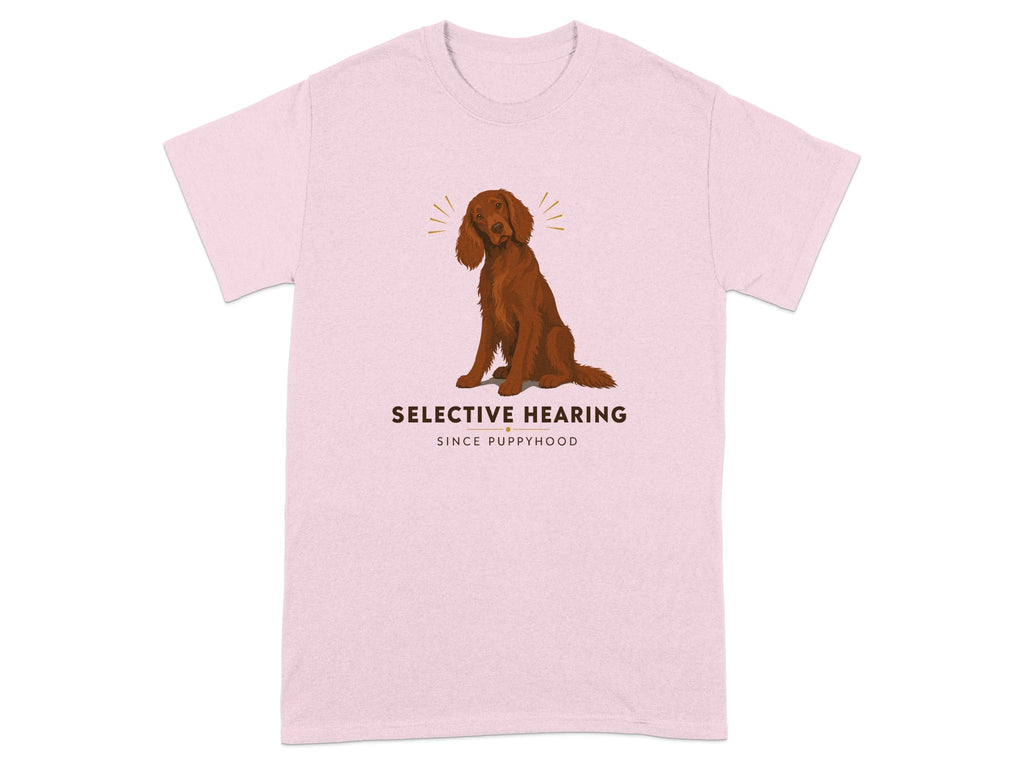 Brown dog sitting on pink t-shirt with text "Selective Hearing Since Puppyhood."