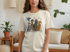 Cream t-shirt with illustration of four different dog breeds sitting in a row.