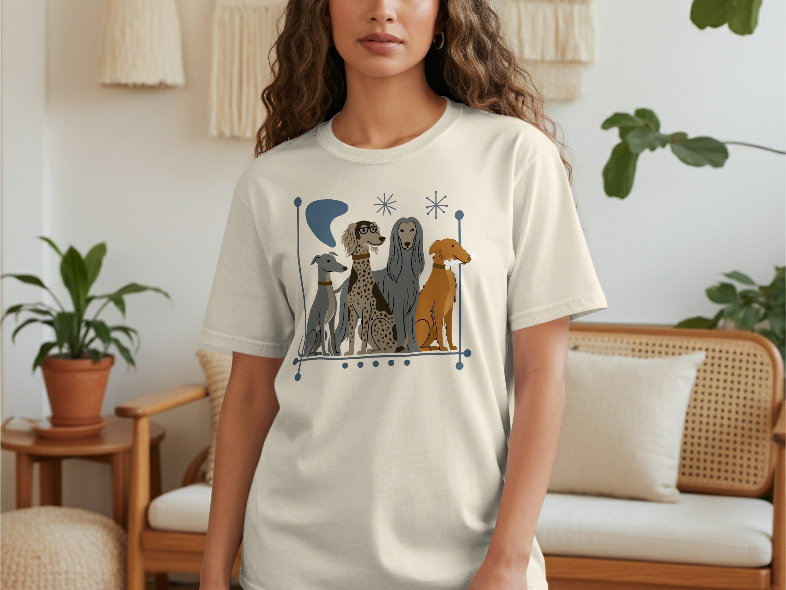 Cream t-shirt with illustration of four different dog breeds sitting in a row.