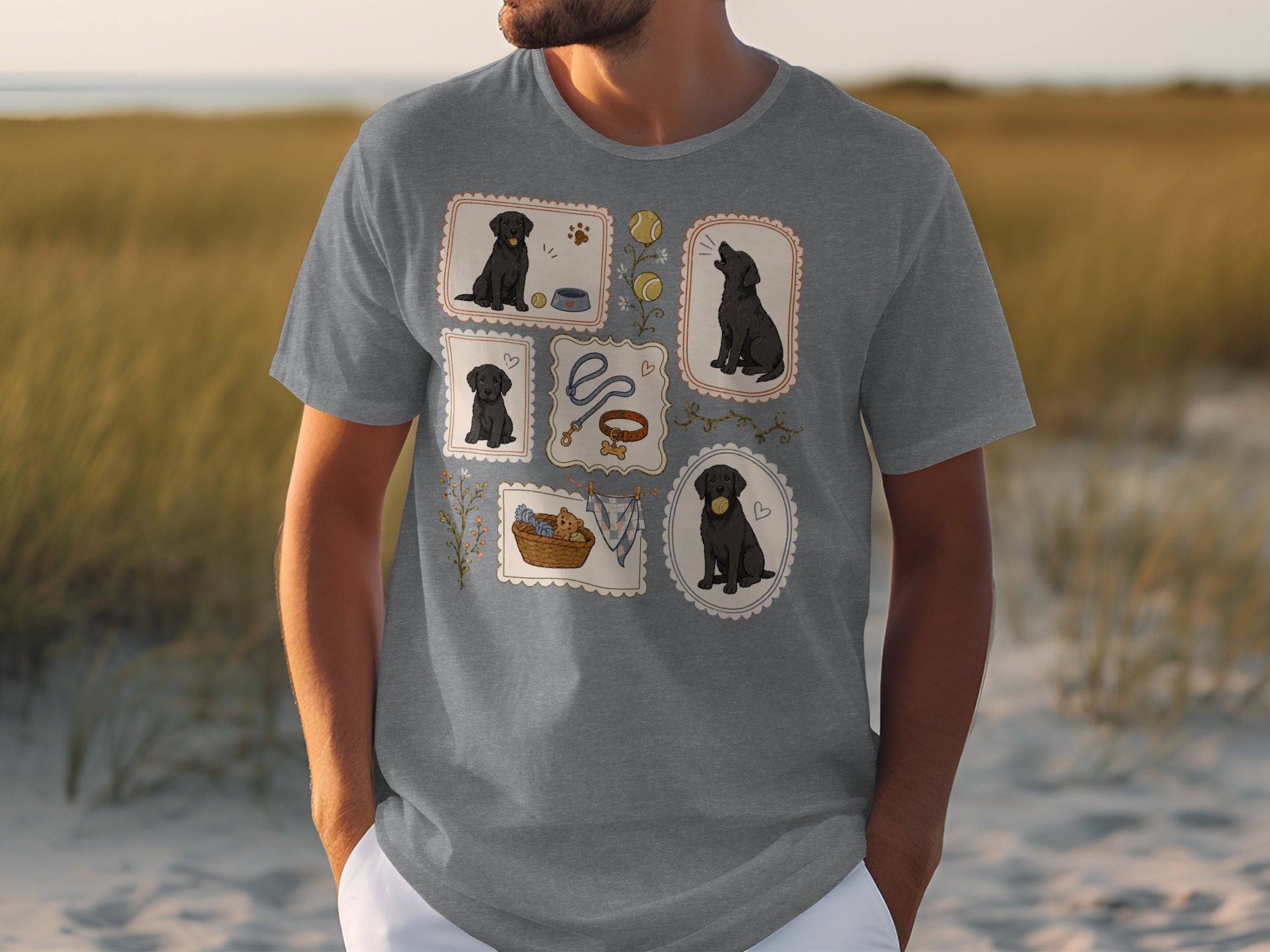 Grey t-shirt with a grid of four framed illustrations of black labradors and dog accessories.