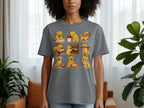 A grey t-shirt with a collage of nine cartoon golden retriever puppies baking bread.