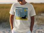White t-shirt with Rottie Days are the Best Days text and Rottweiler on a beach.
