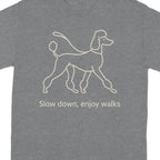 Grey t-shirt with a line drawing of a poodle and text that reads "Slow down, enjoy walks".