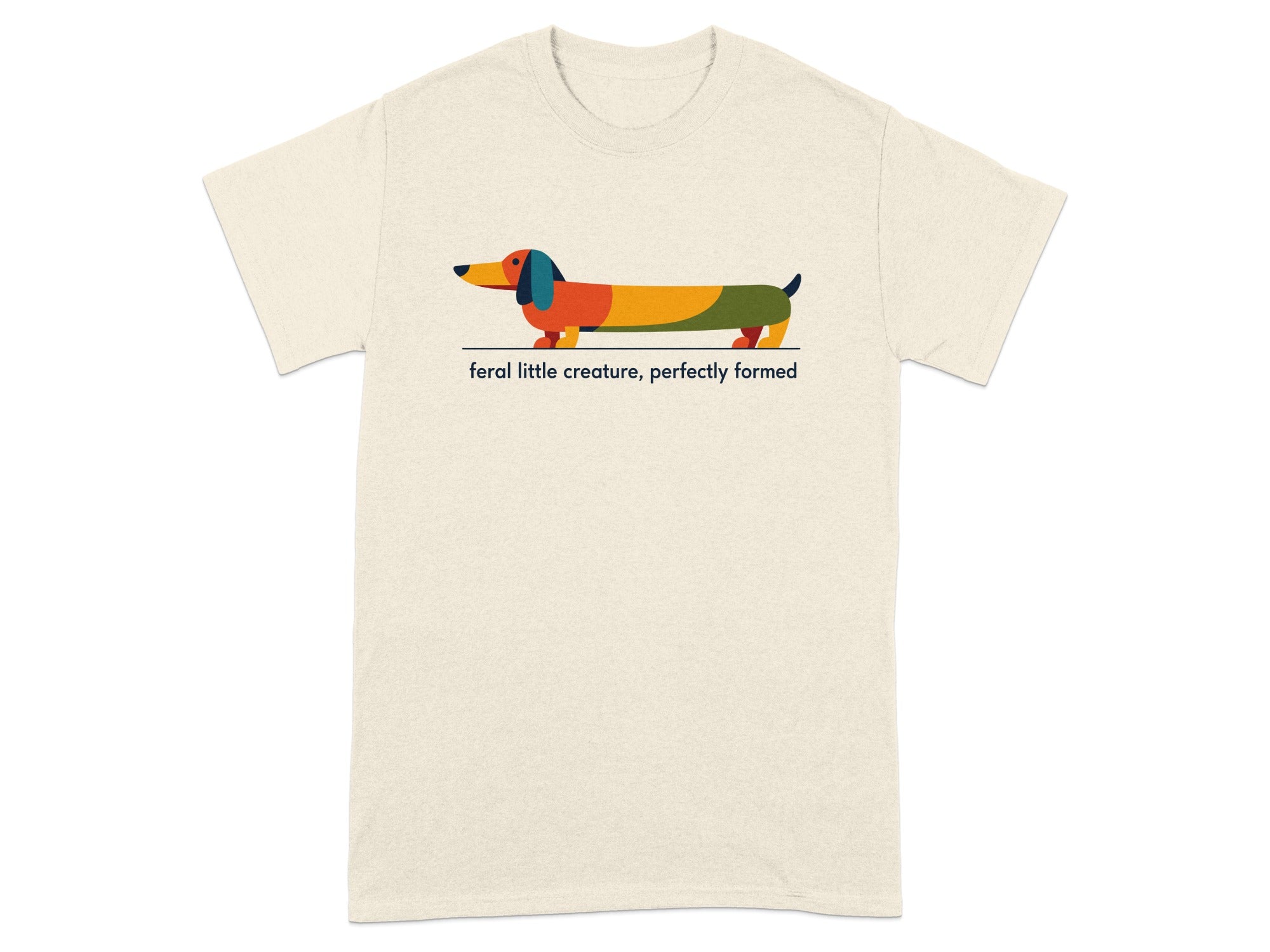 T-shirt with colorful geometric dachshund and text "feral little creature, perfectly formed".