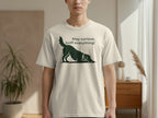 Cream t-shirt with black dog silhouette and "Stay curious, sniff everything!" text.