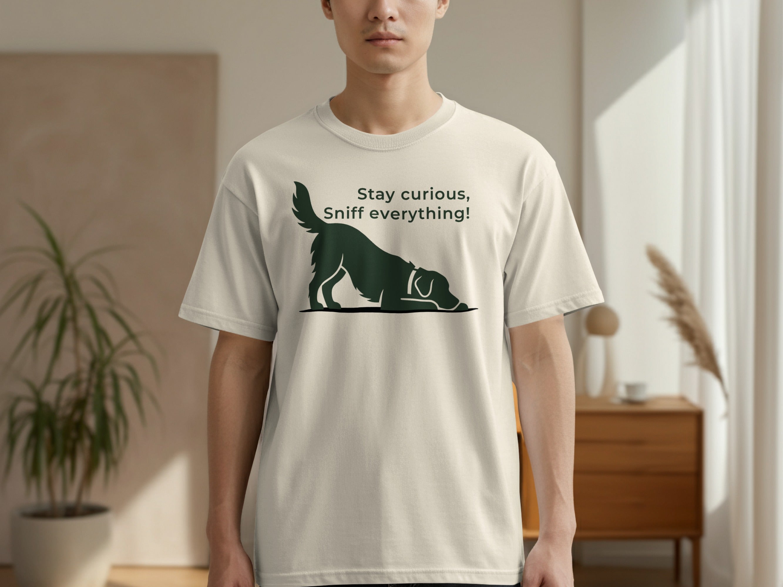 Cream t-shirt with black dog silhouette and "Stay curious, sniff everything!" text.