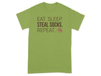 Green t-shirt with text "EAT. SLEEP. STEAL SOCKS. REPEAT." and a dog icon.