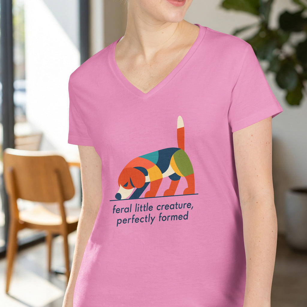 Pink t-shirt with colorful abstract dog graphic and text.