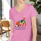 Pink t-shirt with colorful abstract dog graphic and text.
