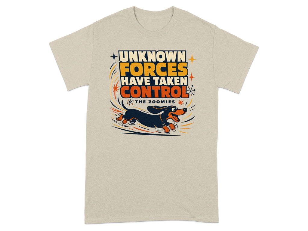 T-shirt with graphic of dachshund running, text "UNKNOWN FORCES HAVE TAKEN CONTROL THE ZOOMIES".