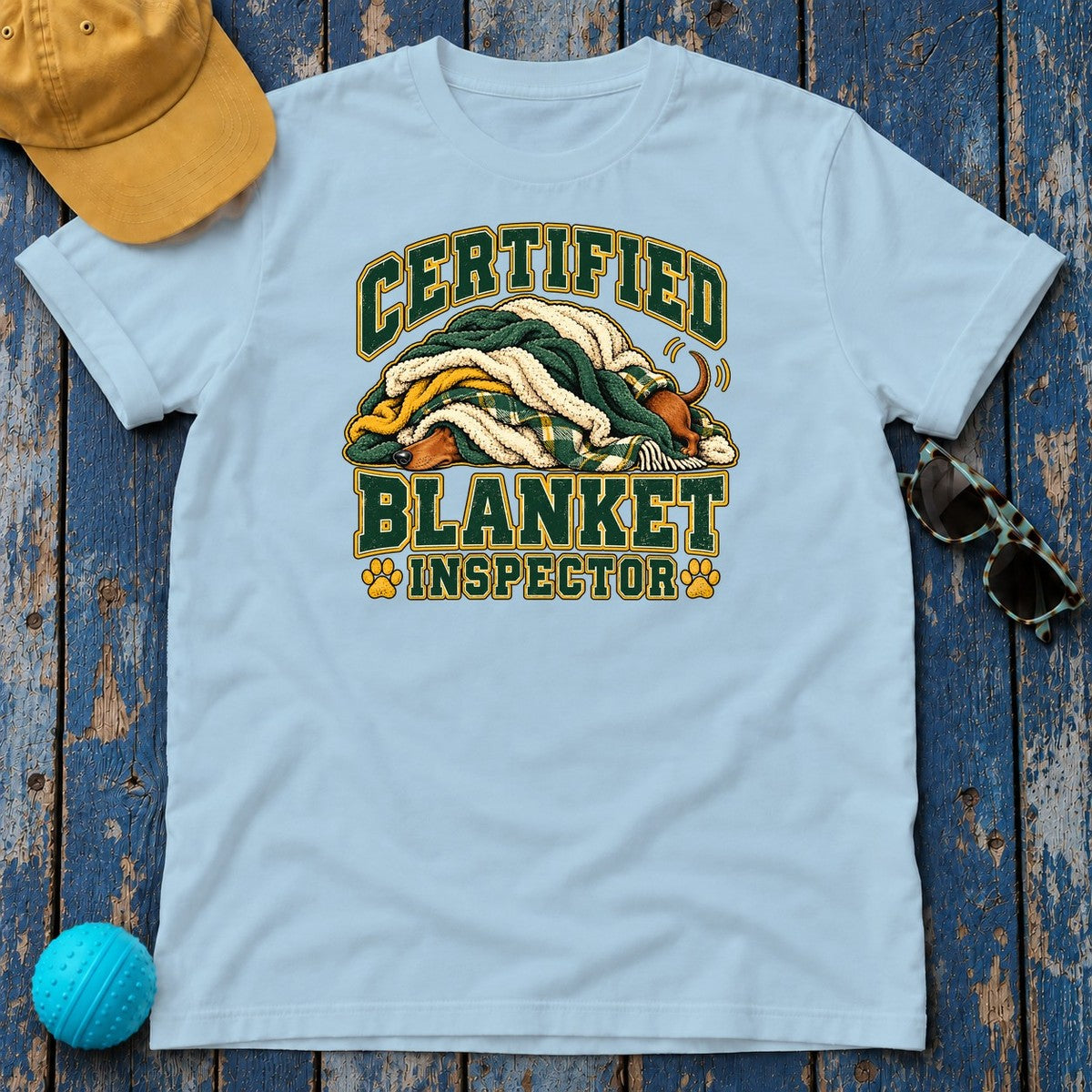 Certified Blanket Inspector Dachshund T-Shirt in Light Blue - flat lay