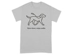 Gray t-shirt with a line drawing of a dog on a leash and text "Slow down, enjoy walks."