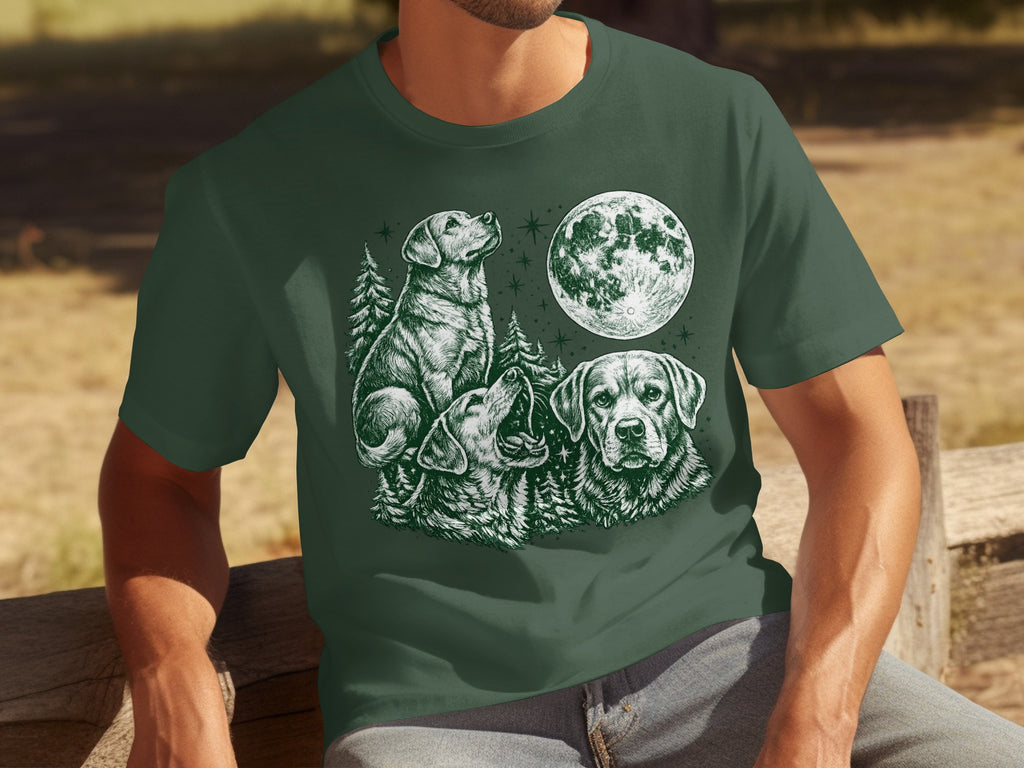 Green t-shirt with white drawing of three dogs, trees, and a full moon.