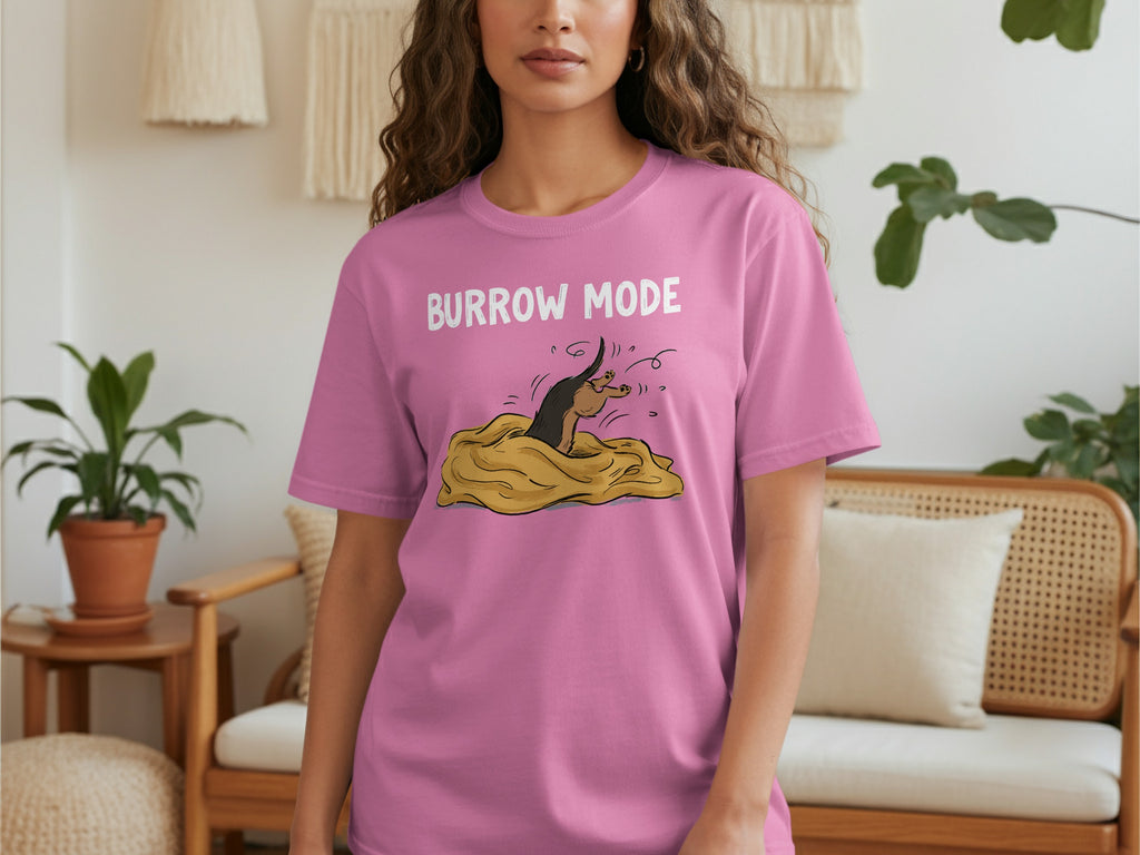 Pink t-shirt with "BURROW MODE" text and a cartoon badger in a blanket.