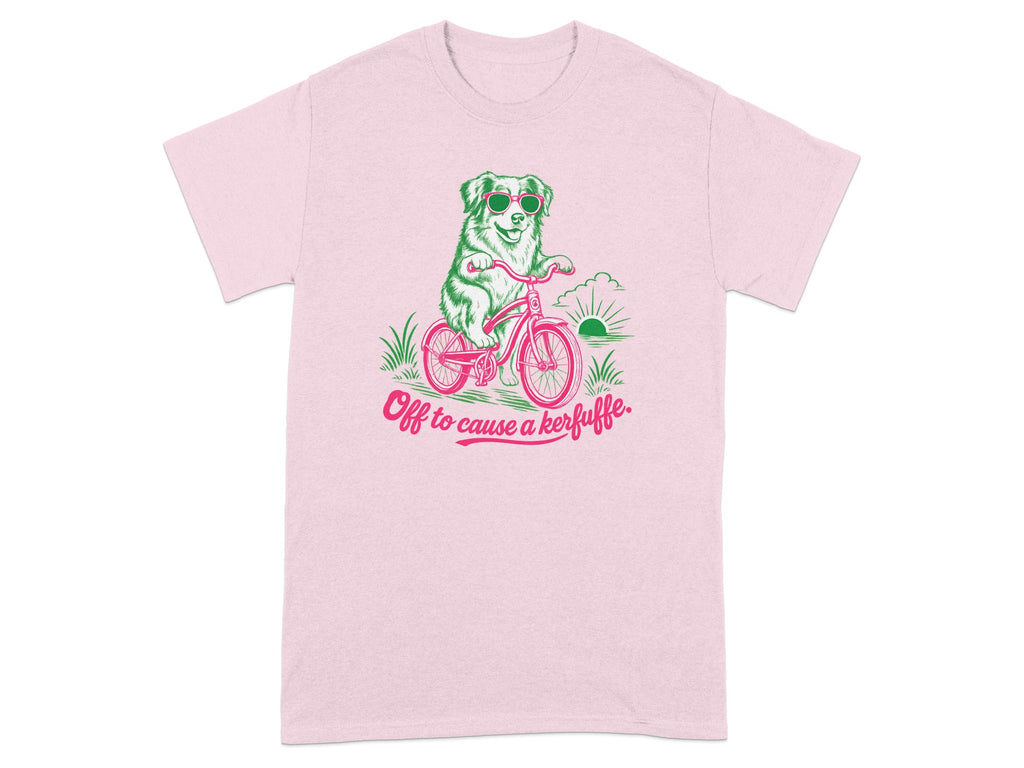 Pink t-shirt with a dog in sunglasses riding a bicycle, "Off to cause a kerfuffle."