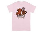 Pink t-shirt with a dachshund and coffee mug graphic that reads "POWERED BY DACHSHUND & COFFEE".