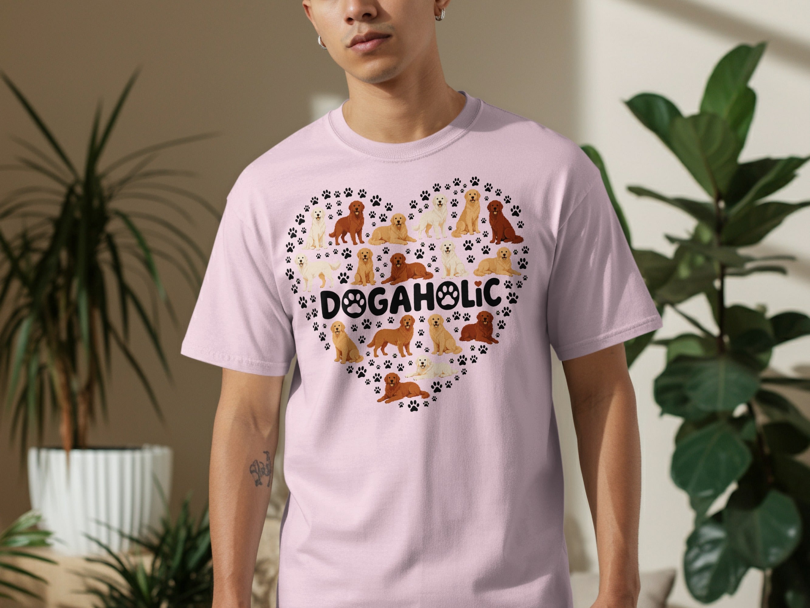 Pink t-shirt with a heart-shaped graphic of various dog breeds.