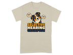 Beige t-shirt with dog and "Selective Hearing Champion" text.