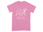 Pink t-shirt with light beige graphic of a dog on a leash and text.