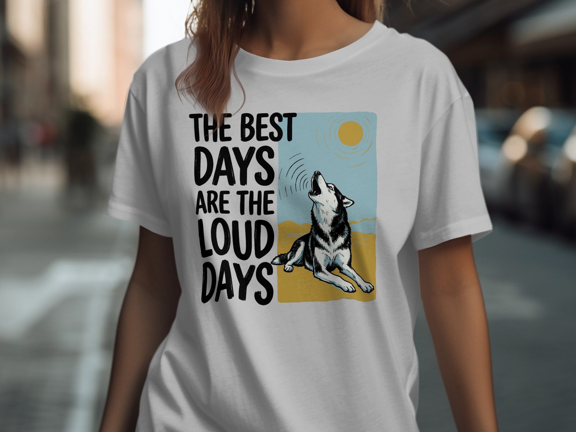 White t-shirt with husky howling at sun, "The best days are the loud days" text.