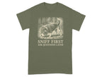 Olive green t-shirt with a beagle in a detective hat sniffing the ground.