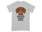 Grey t-shirt with a dachshund graphic and text "DEVOTED. DORKY. DOXIE."