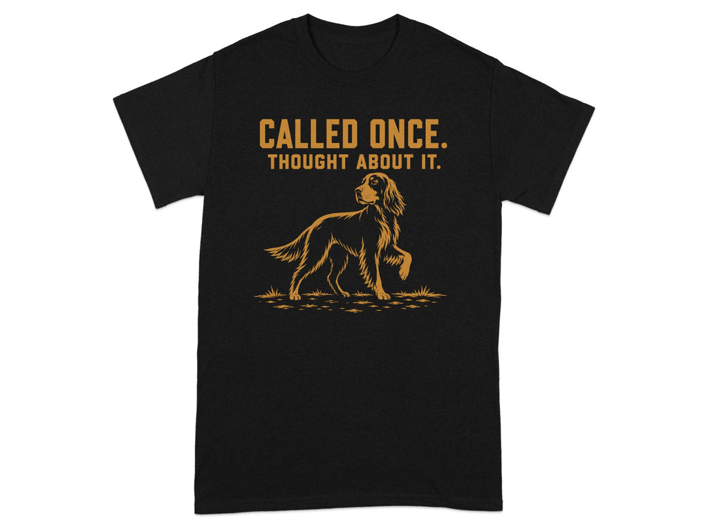 Black t-shirt with orange text "CALLED ONCE. THOUGHT ABOUT IT." and a dog illustration.