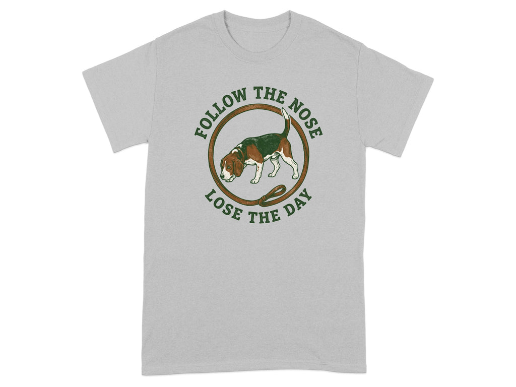Grey t-shirt with circular graphic of a beagle and text "FOLLOW THE NOSE LOSE THE DAY".