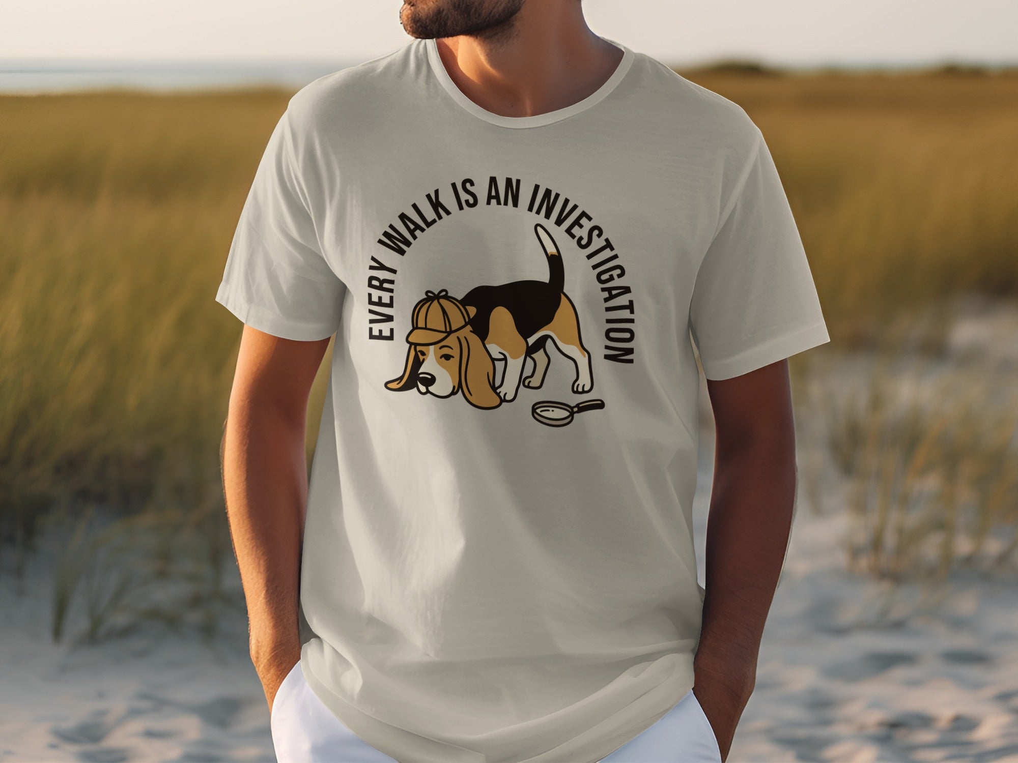Light grey t-shirt with beagle dog wearing detective hat, text "EVERY WALK IS AN INVESTIGATION".