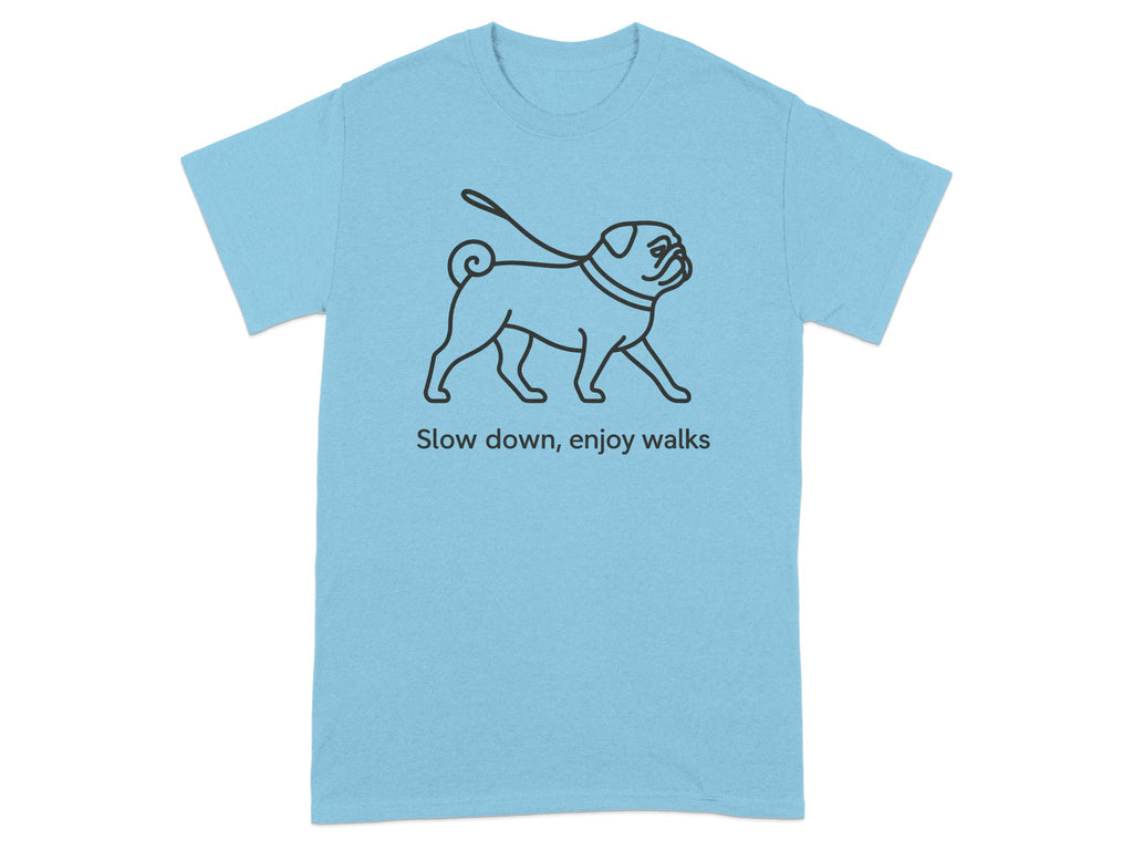 Light blue t-shirt with black line art of a pug on a leash and the text "Slow down, enjoy walks".